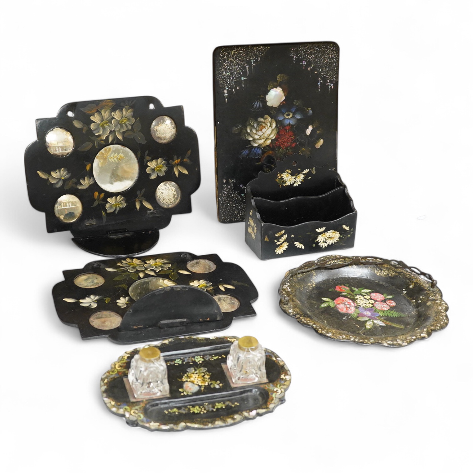 A collection of Victorian papier maché to include an inkstand, a pair of Victorian mirrored wall brackets and a swing handled dish, largest 30cm high